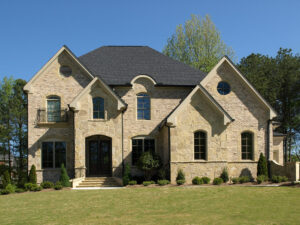 Luxury Model Home with blue sky and green grass