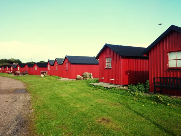 A red barndominium living space on a piece of land