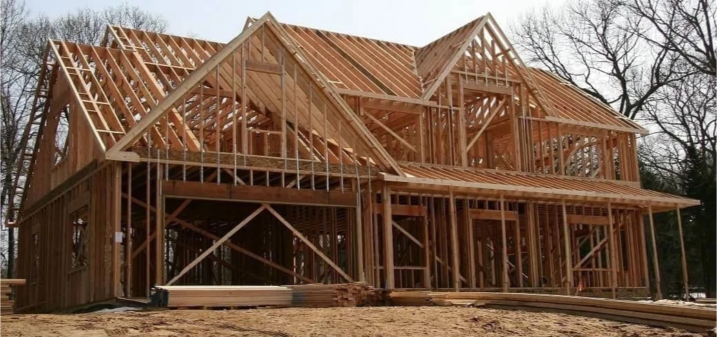 House under construction with wooden framing.