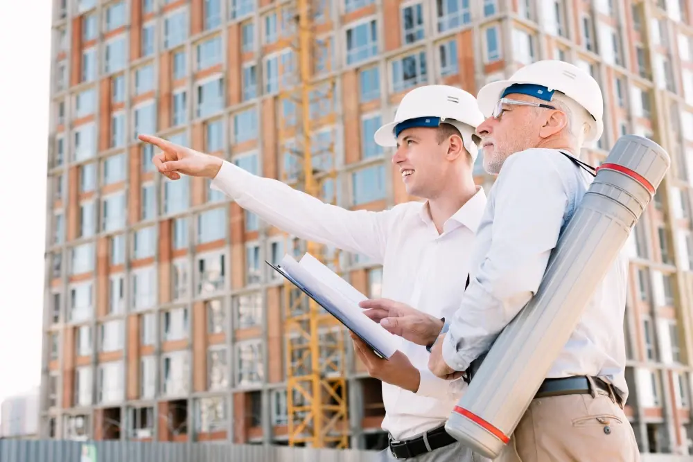 Builders discussing construction project.