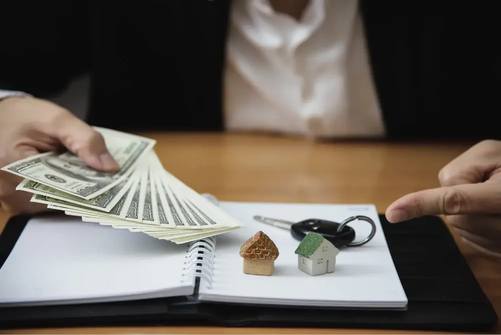 Handing money across a desk.