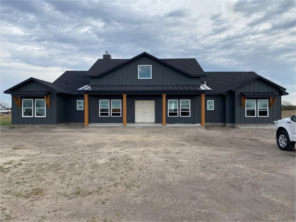 Dark house with wood accents and a clean facade.